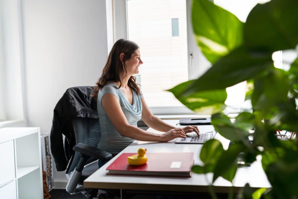 Picture of Nicole Scharrenberg working on her laptop